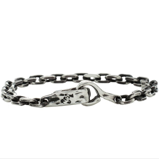 Karen Karch Hooked Silver 5mm Diamond Cut Cable chain bracelet showing logo back side of Handmade Weathered Spring Hook Clasp on a white background.
