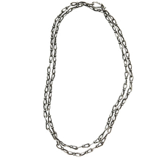 Karen karch Jaipur Infinite sterling silver handmade chain with figure eight shaped links detailed with 4 balls at the center, shown doubled.