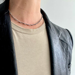 Karen karch Jaipur Infinite sterling silver handmade chain with figure eight shaped links detailed with 4 balls at the center, worn on the neck