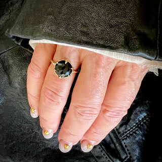 Karen Karch by Deme Wolfe Large Rose Cut Black Onyx Gemstone 10k Yellow Gold Mystical Crown Solitaire Ring on a hand.