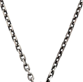 Karen Karch oxidized silver diamond-cut cable chain necklace with a lobster lock clasp and a branded end tag closer up.
