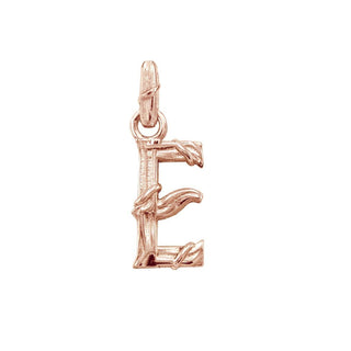 Karen Karch textured 18k rose gold charm in the shape of the letter 'E' with a vine-detail and rectangular bail on white background.