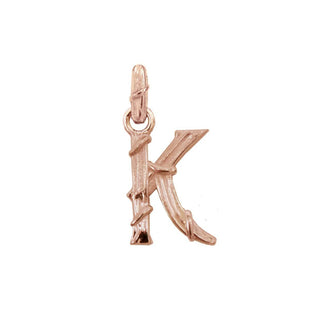 Karen Karch textured 18k rose gold charm in the shape of the letter 'K' with a vine-detail and rectangular bail on white background.