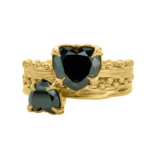 Karen Karch Jaipur Swing and Sway heart-shaped black diamonds 2-ring set in gold with weathered texture and ball details on white background.