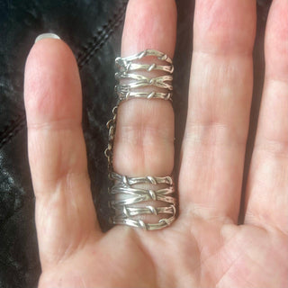 Karen Karch Gabrielle Rose silver knuckle ring back side showing connection of two Gladiator Vine Bands extending the length of the finger on a finger.