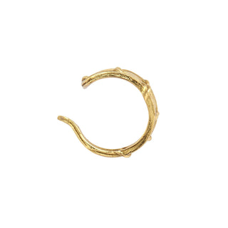 Karen Karch Triple Vine yellow gold ear cuff with three rows of textured twining vines top view on white