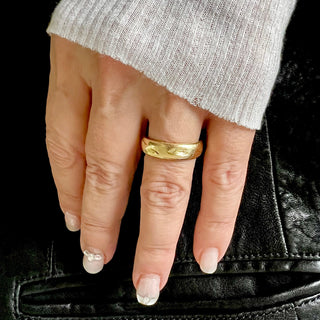 Karen Karch Gold Glimmer domed band on a hand.