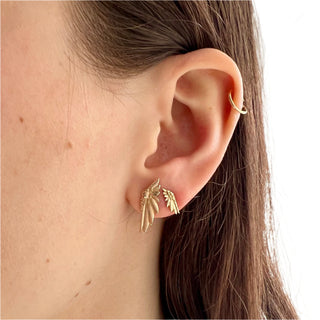 Karen Karch by Deme Wolfe  small amd larger 10k yellow gold stud earrings with a wing design on the ear