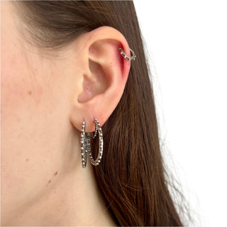 Karen Karch Jaipur Evermore pair of 1-inch silver hoop earrings with a repeating ball detail side by side in one ear