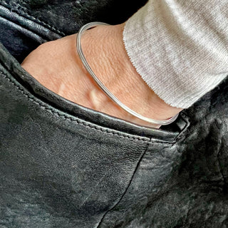 Karen Karch weathered Silver Oval Shape Jaipur Serene bangle on wrist