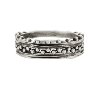 A Karen Karch Jaipur Swing and Sway Sterling Silver 2-Ring Stack with a textured center and repeating ball details on a white bacground.