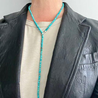 A turquoise lariat necklace with a silver weathered texture loop and a pull-through bar closure, necklace0n,  by Karen Karch