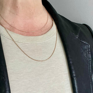 Karen Karch 1.5mm rose gold cable chain necklace close up on neck in 2 legths
