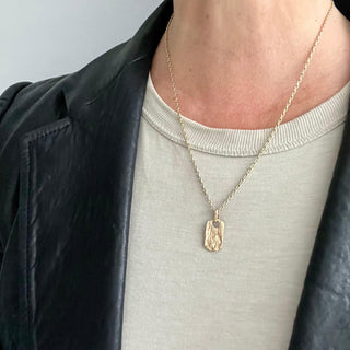 Karen Karch Small 10ky unearthed small Dog Tag on chain on model in black leather jacket