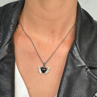 Karen Karch by Deme Wolfe Black Onyx Sapphire Silver Double Victory Winged Heart Amulet on Chain on person