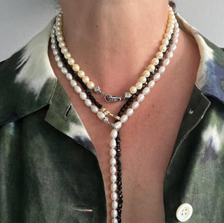 A pearl choker necklace with a black diamond silver clasp and handmade cube silver beads layered with Lariats by Karen Karch