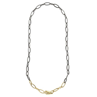 A Karen Karch Silver and Gold Textured Toggle Chain Necklace Shown in an oval shape with a white background