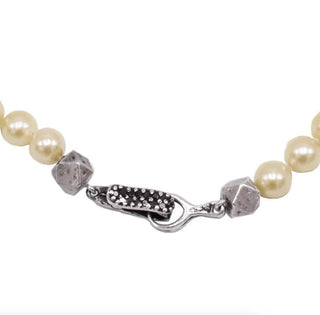 Close up of a Karen Karch black diamond silver clasp and handmade cube silver beads on cultured Akoya Pearls