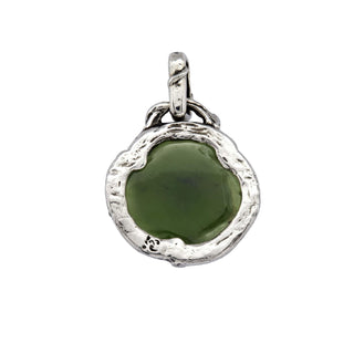 Karen Karch back of silver charm with a green jade rosebud carving on a vine detailed bail on white background