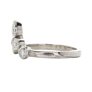 Karen Karch Turned out Invincible tiara Ring in Platinum and Diamonds on white backround, side view