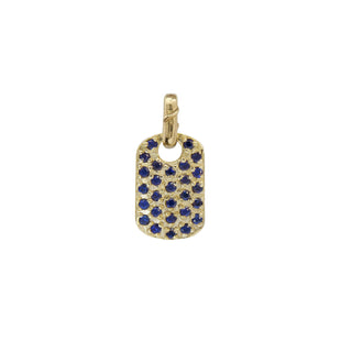 Karen Karch 10k yellow gold XS Dog tag studded with bue sapphires on a white background. 