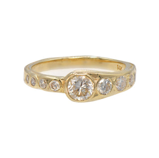 Karen karch 14ky gold weathered asymmetric wrapped half eternity band with diamonds on a white background