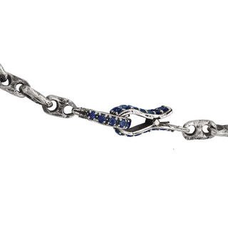 Close up of Karen Karch Blue Sapphire Studded Spring Hook Clasp Side View on Silver Handmade Chain Weathered 2-Hole Link Bracelet.