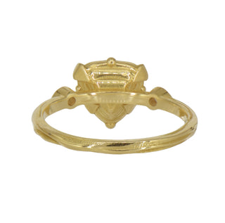 Back of a Karen Karch 18k Dark Grey Trilliion Diamond held by 4 claws with a colorless diamond on each side on a weathered gold band