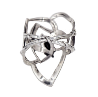 Back View of a Karen Karch Silver Rose Tattoo Outline Ring with ball details and a dark blue sapphire center stone held by 4 claws on a white background.