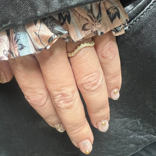 Karen Karch Jaipur Sway Yellow Gold Diamond Half eternity band with a cuve and ball details on a hand. 