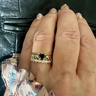 Karen Karch Jaipur Collection Rings stacked on hand, 18ky Black Diamond Heart Solitaire and 18kw Swing Half Eternity
