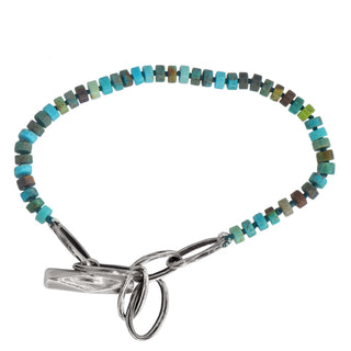 Karen Karch Silver Weathered Toggle Oval  Link Adjustable length Turquoise heshi bead bracelet on white background.