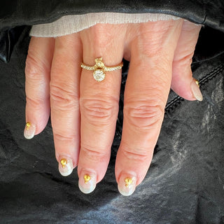 Karen Karch by Deme Wolfe Studded Snake Solitaire in 14k yellow gold an offset Lab Diamond on a hand