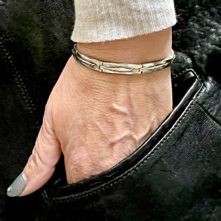 Karen Karch Silver Vine Tattoo Maintay bracelet on a wrist