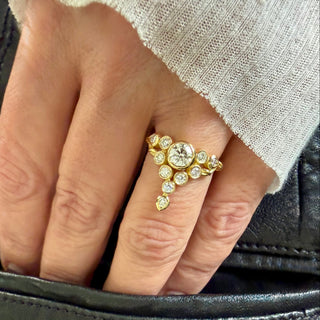 Karen Karch Floating Star 18k Yellow Gold with Colorless Diamonds set in bezels on a hand.