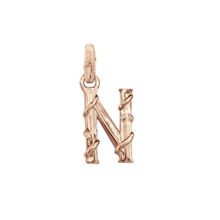 Karen Karch textured 10k rose gold charm in the shape of the letter 'N' with a vine-detail and rectangular bail on white background.