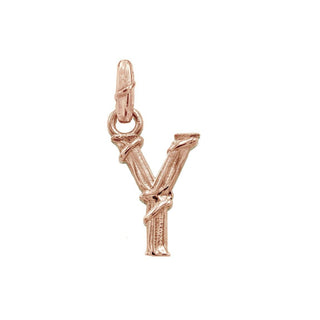 Karen Karch textured 10k rose gold charm in the shape of the letter 'Y' with a vine-detail and rectangular bail on white background.