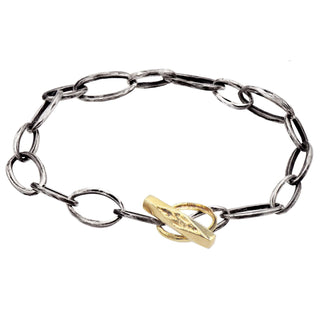 Karen Karch 10k yellow gold  Weathered Outshine Toggle and Oval Loop Clasp on Silver Oval Link Chain bracelet on white background.