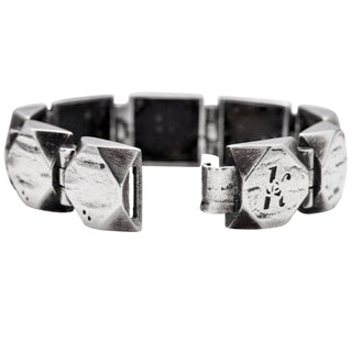 Karen Karch Silver Outshine 16mm wide bracelet with geometric square faceted corner with logo clasp shown open.