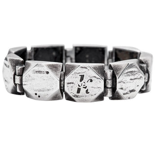 Karen Karch Silver Outshine 16mm wide bracelet with geometric square faceted corner links on a white background.