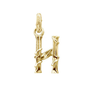 Karen Karch textured 18k yellow gold charm in the shape of the letter 'H' with a vine-detail and rectangular bail on white background.