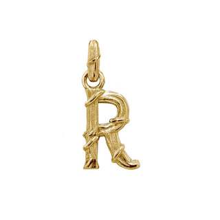 Karen Karch textured 18k yellow gold charm in the shape of the letter 'R' with a vine-detail and rectangular bail on white background.
