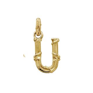 Karen Karch textured 18k yellow gold charm in the shape of the letter 'U' with a vine-detail and rectangular bail on white background.