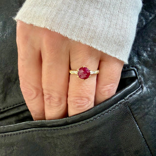 Karen Karch Diamond Studded Vine Round Ruby Rose Cut Solitaire 18k Yellow Gold Ring on a hand.