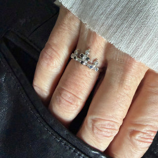 Karen Karch 18k White Gold Belgian Tiara with Black and Gray Diamonds on a hand.