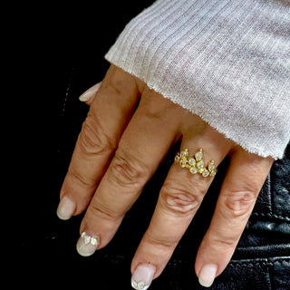 Karen Karch 18k Yellow Gold Belgian Tiara Ring with 10 diamonds clustered in a crown shape on a hand.
