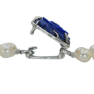Karen Karch custom carved lapis rose centerpiece clasp on double strand of pearls claose up, clasp open.
