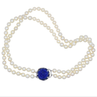 Karen Karch custom carved lapis rose centerpiece clasp on double strand of pearls.