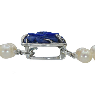 Karen Karch custom carved lapis rose centerpiece clasp on double strand of pearls, clasp closed clsoe up. 
