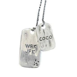Karen Karch Customized Silver dog tag necklace with engraved text on a white background